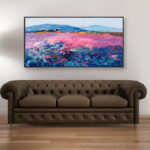 Landscape painting with lavender, original oil painting on canvas hanging in a modern living room with a brown sofa