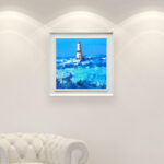 Lighthouse oil painting on canvas with rich impasto texture hanging in a modern living room with a white sofa