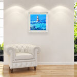 Lighthouse oil painting on canvas with rich impasto texture hanging in a modern living room with a white sofa, showing full room decor.
