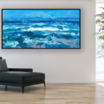 Ocean painting, original oil painting on canvas hanging in a modern living room with a black sofa