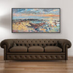 Beach painting at sunset, original oil painting on canvas hanging in a modern living room with a brown sofa