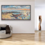 Beach painting at sunset, original oil painting on canvas hanging in a modern living room with a beige sofa